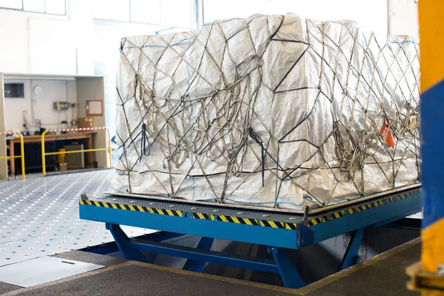 a large cargo wrapped and ready to be loaded onto air plane